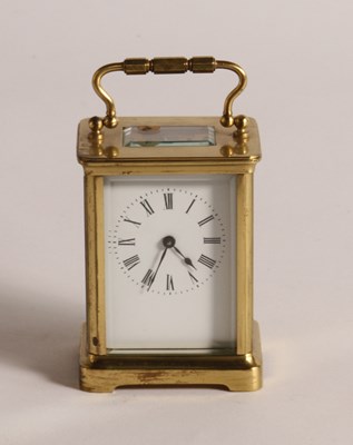 Lot 219 - A brass carriage clock, the enamelled dial...