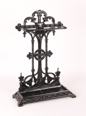 Lot 547 - A black painted cast iron stick stand, in the...