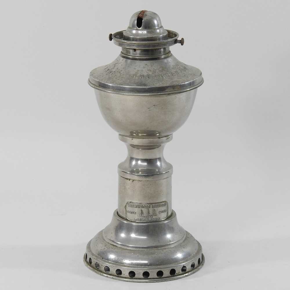 Lot 154 - A mid 20th century metal patent clockwork oil lamp base