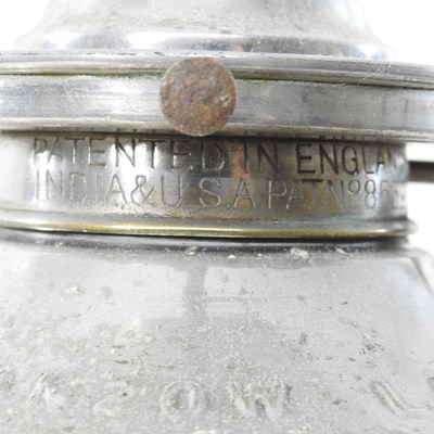 Lot 154 - A mid 20th century metal patent clockwork oil lamp base