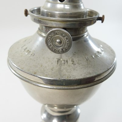 Lot 154 - A mid 20th century metal patent clockwork oil lamp base