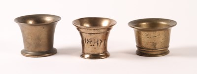 Lot 190 - A collection of three bronze mortars,...