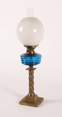 Lot 214 - A Victorian brass oil lamp, having a blue...