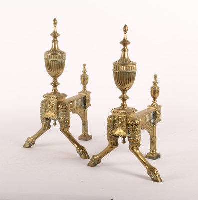 Lot 219 - A pair of Neoclassical brass andirons, 19th...