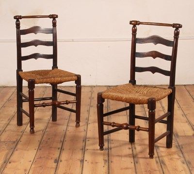 Lot 115 - A pair of elm ladderback dining chairs, 19th...