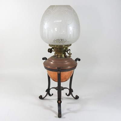Lot 127 - An early 20th century copper and brass oil lamp and shade