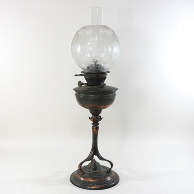 Lot 249 - An Arts and Crafts copper oil lamp and shade