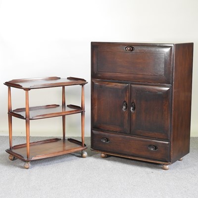 Lot 523 - An Ercol Windsor cabinet, together with an...
