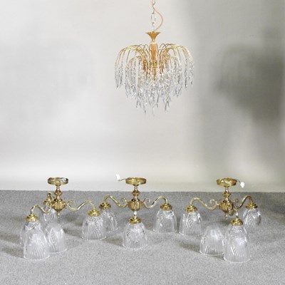 Lot 538 - A set of three modern brass and cut glass...