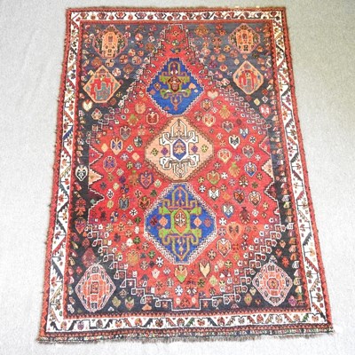 Lot 16 - A Persian carpet, decorated with diamonds, 248...