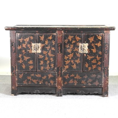 Lot 31 - A Chinese black lacquered side cabinet,...