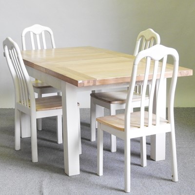 Lot 514 - A white painted light oak dining table, with...