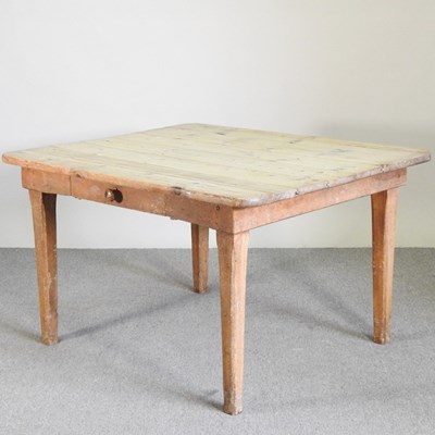 Lot 28 - An antique pine dining table, with a scrubbed...