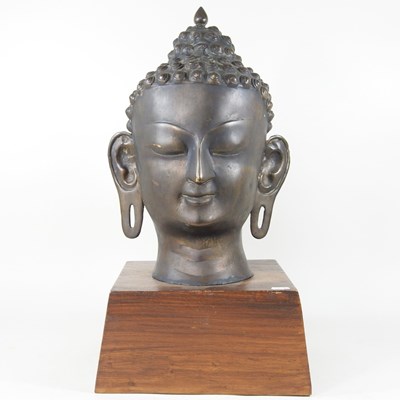 Lot 468 - A large bronzed head of a Thai Buddha, mounted...