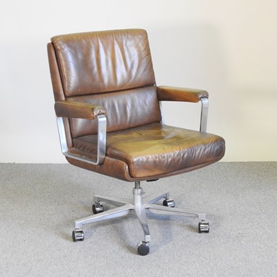 Lot 13 - A 1970's brown upholstered swivel desk chair,...