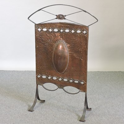 Lot 710 - An Arts and Crafts hammer beaten copper fire screen