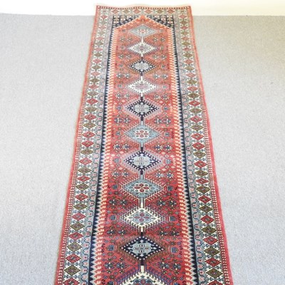 Lot 542 - A North-West Persian runner, with a row of...