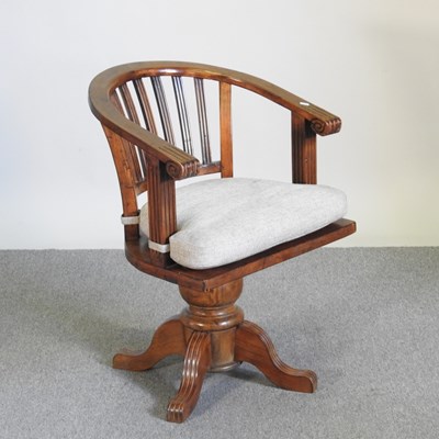 Lot 367 - An early 20th century oak swivel desk chair,...