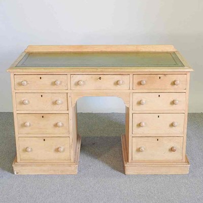 Lot 289 - A Victorian pine kneehole desk, with a green...