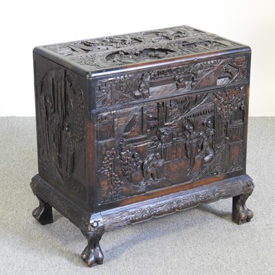 Lot 413 - An Eastern carved hardwood drinks cabinet,...