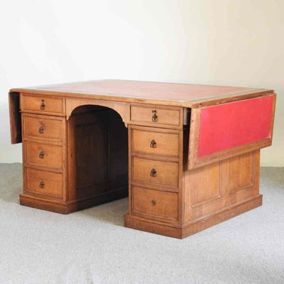Lot 488 - An early 20th century oak drop leaf partners...