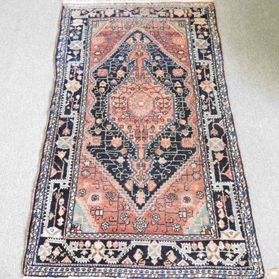 Lot 567 - A Persian rug, with a large central medallion,...