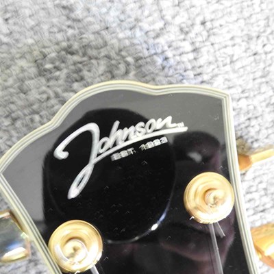 Lot 318 - A red Johnson Les Paul electric guitar