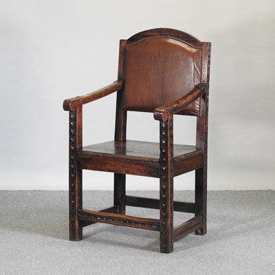 Lot 553 - A 19th century continental carved oak open armchair