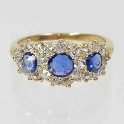 Lot 245 - A sapphire and diamond triple cluster ring,...