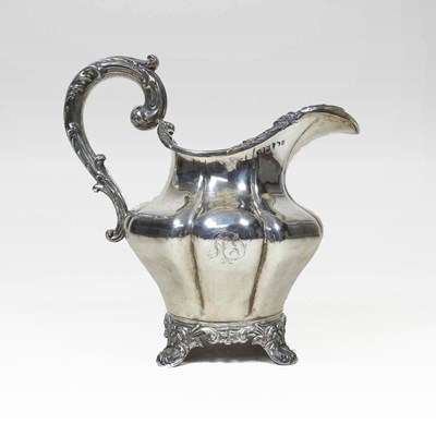 Lot 1 - A George III silver cream jug, of fluted shape,...