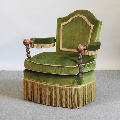 Lot 714 - A mid 20th century French green upholstered armchair