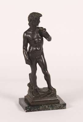 Lot 487 - After Michelangelo, a bronze figure of David,...