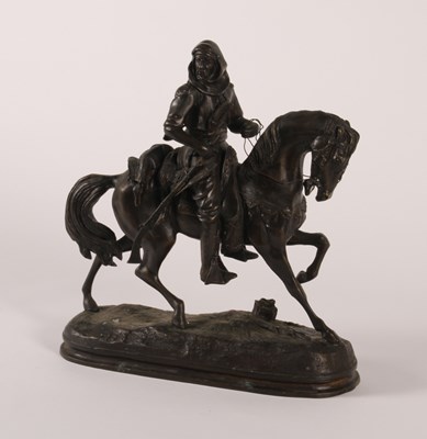 Lot 120 - A bronze figure of a huntsman on horseback,...