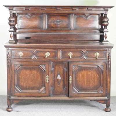 Lot 526 - A 1920's oak sideboard, of Jacobean style, on...
