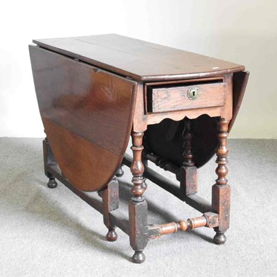 Lot 351 - An 18th century gateleg dining table, on...