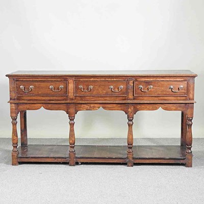 Lot 227 - An 18th century style oak dresser base, 20th...