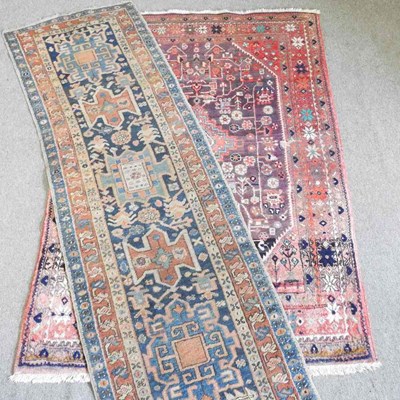 Lot 11 - A Persian carpet on red ground, 223 x 140cm,...