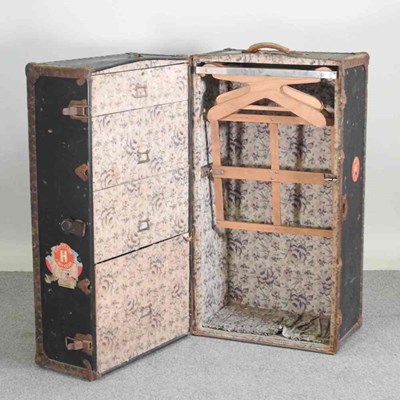 Lot 452 - An early 20th century travelling trunk, with a...