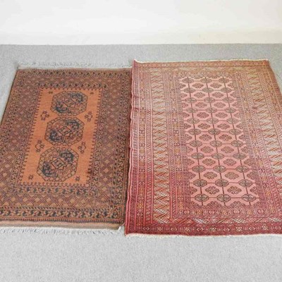 Lot 320 - A Bokara rug, on a red ground, 173 x 124cm and...