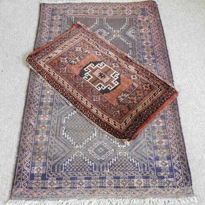 Lot 528 - A Persian rug, 144 x 84cm together with...