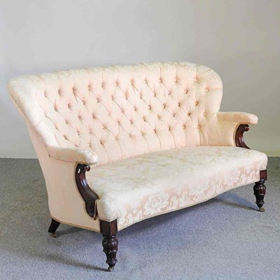 Lot 362 - A Victorian peach upholstered couch, with a...