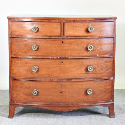 Lot 566 - A Regency mahogany bow front chest of drawers,...