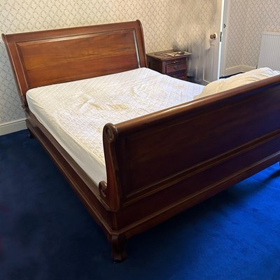 Lot 552 - A modern cherrywood sleigh bed, with a slatted...