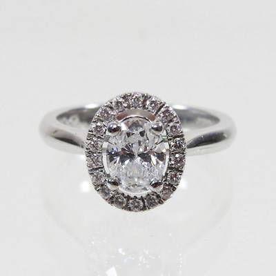 Lot 32 - A platinum and diamond cluster ring, of halo...