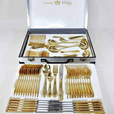 Lot 348 - A Solingen gold plated canteen of cutlery, in...