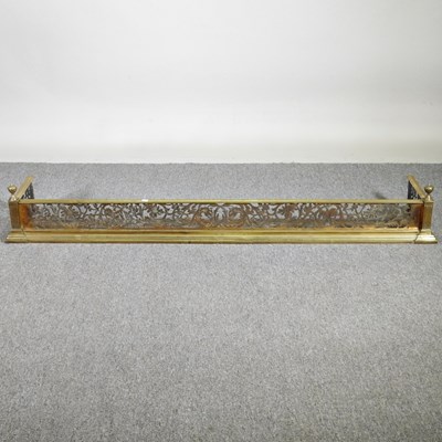 Lot 280 - An ornate 19th century pierced brass fender,...