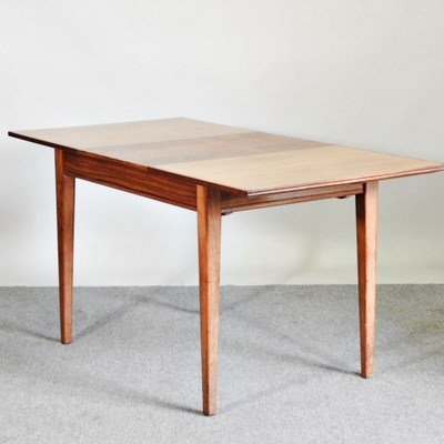 Lot 621 - A mid 20th century teak extending dining table,...