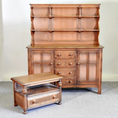 Lot 573 - An Ercol elm dresser, together with an Ercol...
