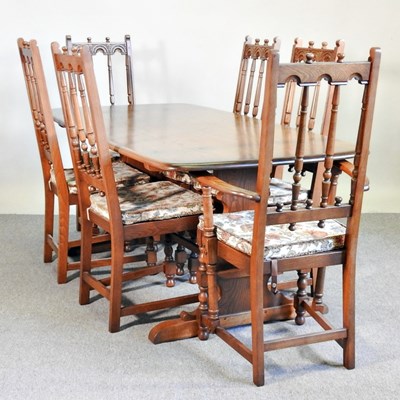 Lot 431 - An Ercol dining table, together with a set of...