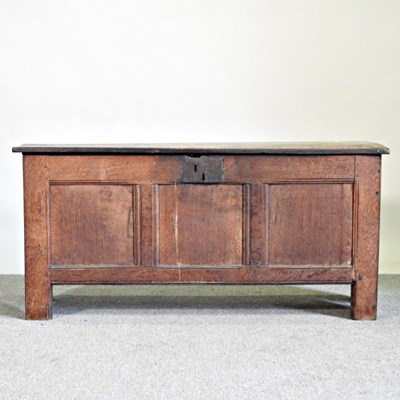 Lot 499 - An 18th century oak coffer, with a hinged lid...